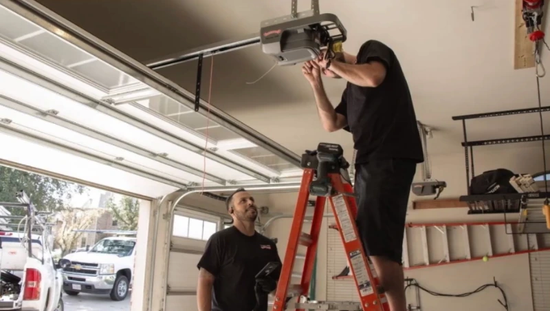 Professional handyman installing a garage door opener in Green Bay, Wisconsin
