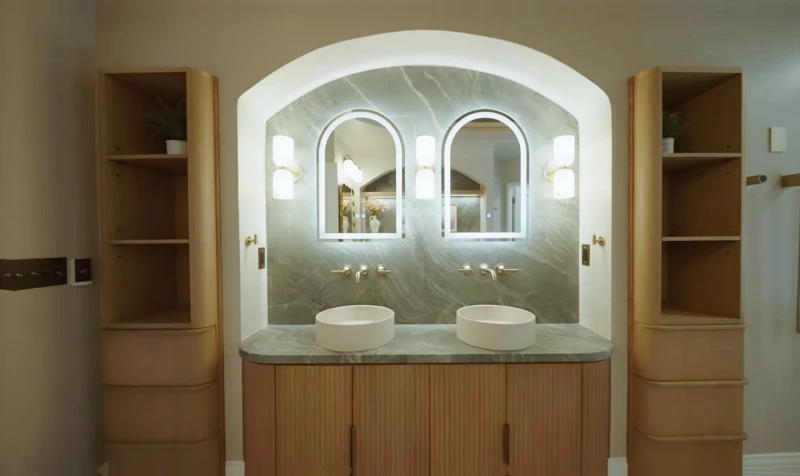 Bathroom vanity installation with marble backsplash in Green Bay, Wisconsin